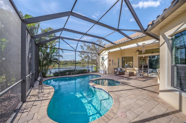 7108 Callander Cv, Lakewood Ranch, FL 34202 - view of swimming pool with a pool with connected hot tub, glass enclosure, a patio, and ceiling fan