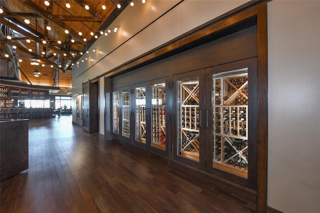 7108 Callander Cv, Lakewood Ranch, FL 34202 - wine room featuring high vaulted ceiling and hardwood / wood-style flooring