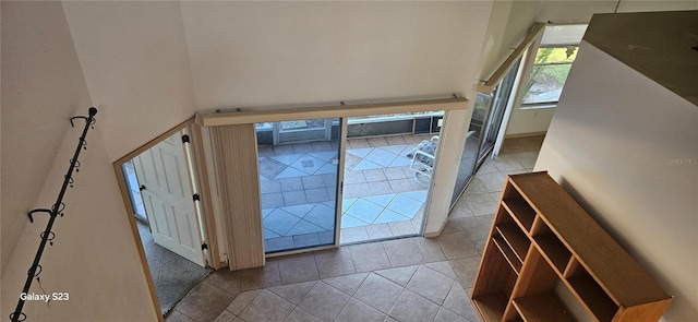 doorway featuring light tile patterned floors