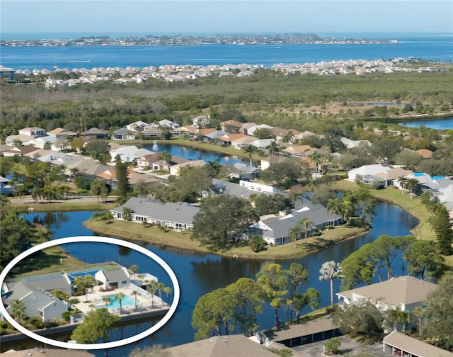 birds eye view of property featuring a water view and a residential view