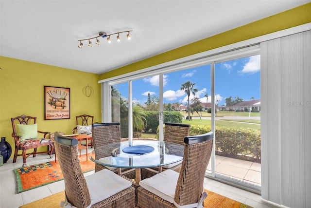 dining space with light tile patterned flooring