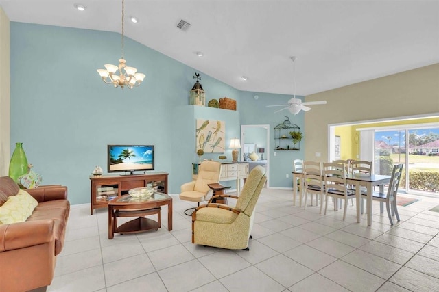 living area with light tile patterned floors, visible vents, high vaulted ceiling, and ceiling fan with notable chandelier