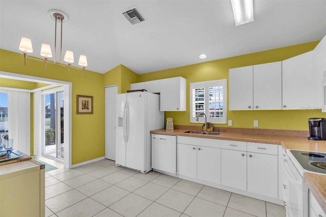 kitchen featuring visible vents, a sink, white cabinetry, white appliances, and light tile patterned flooring