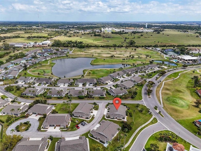 bird's eye view with a residential view, view of golf course, and a water view