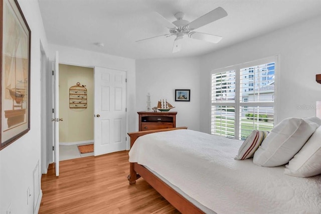 bedroom featuring light wood finished floors and ceiling fan