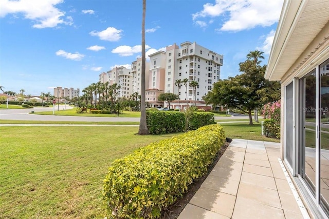 view of home's community featuring a lawn