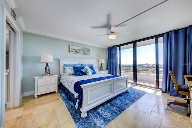 bedroom featuring ceiling fan, baseboards, access to exterior, expansive windows, and stone tile flooring