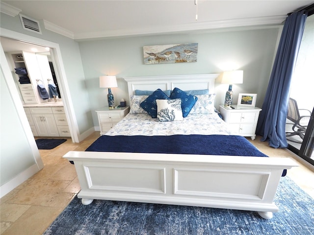 bedroom with stone tile floors, baseboards, visible vents, connected bathroom, and ornamental molding