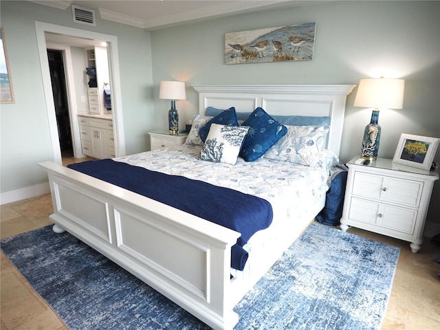 bedroom featuring baseboards, connected bathroom, visible vents, and crown molding