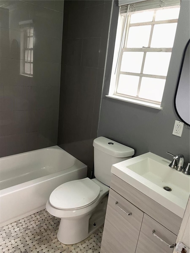 full bath featuring toilet, shower / bathtub combination, and vanity