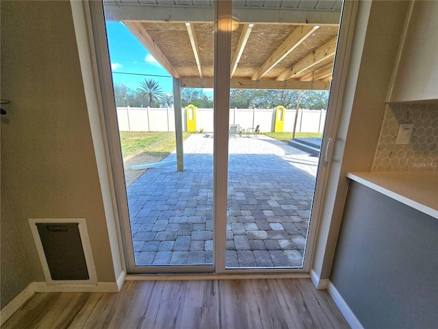 entryway featuring light wood-style floors and baseboards