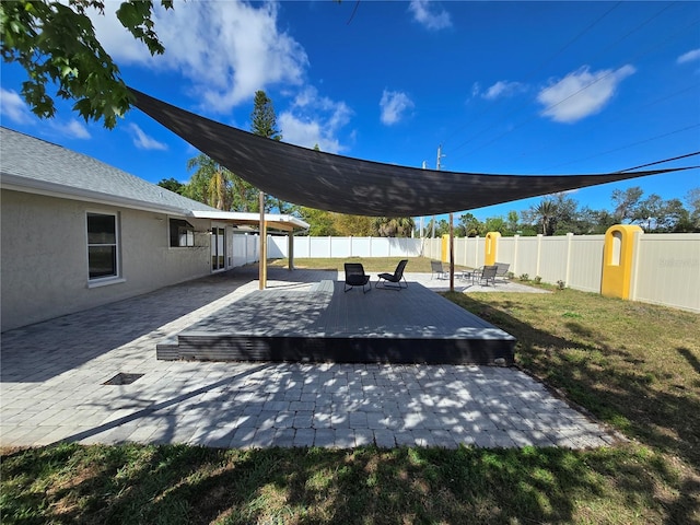 view of patio / terrace featuring a fenced backyard and a wooden deck