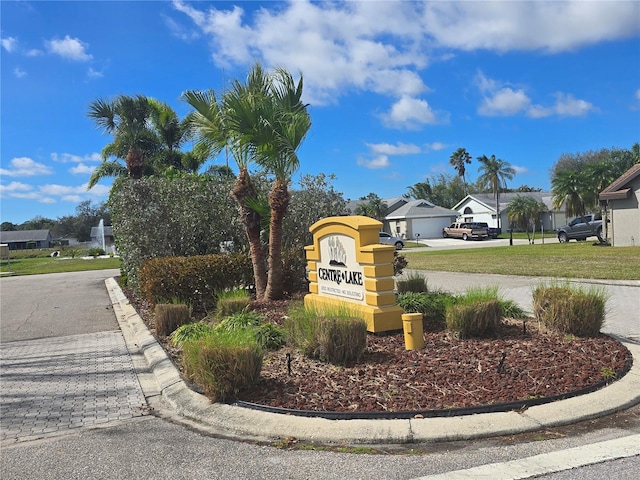 community sign with a residential view and driveway