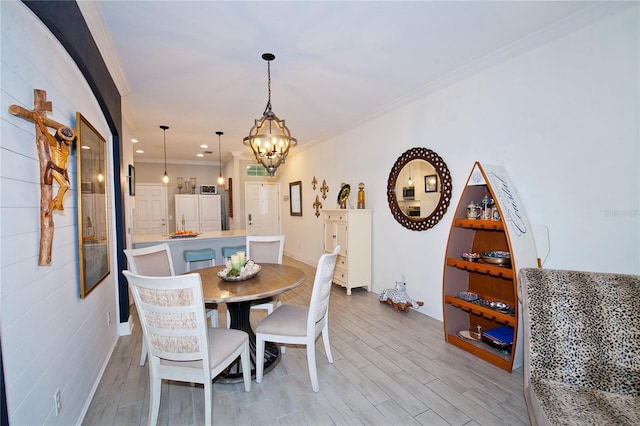 5118 78th St Cir E, Bradenton, FL 34203 - dining area with light wood-style floors, recessed lighting, ornamental molding, and an inviting chandelier