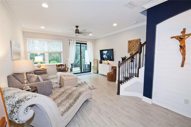 5118 78th St Cir E, Bradenton, FL 34203 - living room featuring light wood finished floors, visible vents, stairs, and ornamental molding