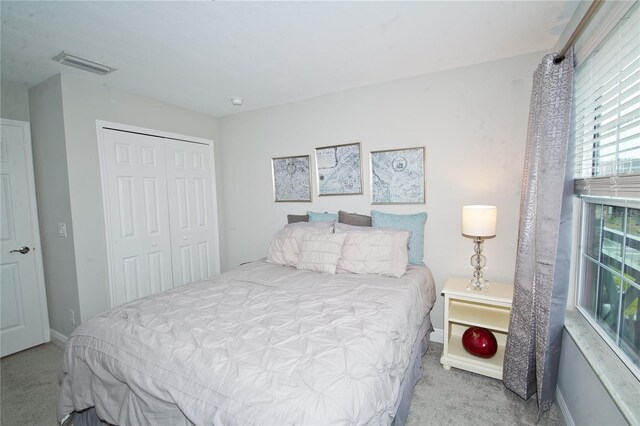5118 78th St Cir E, Bradenton, FL 34203 - carpeted bedroom with a closet, visible vents, and baseboards