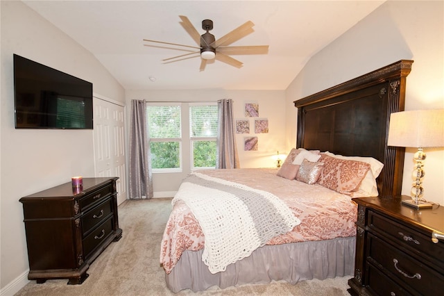 5118 78th St Cir E, Bradenton, FL 34203 - bedroom featuring light carpet, baseboards, vaulted ceiling, and a closet