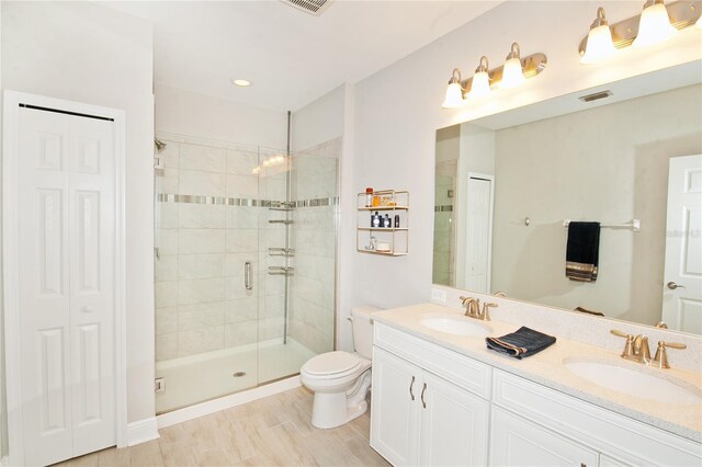 5118 78th St Cir E, Bradenton, FL 34203 - bathroom featuring a closet, visible vents, toilet, a sink, and a shower stall