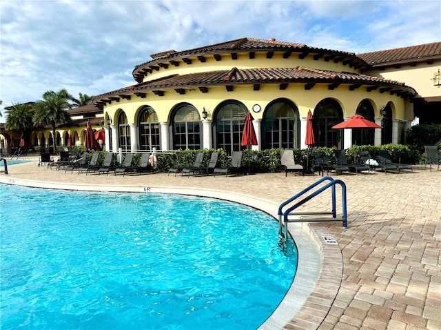 community pool with a patio