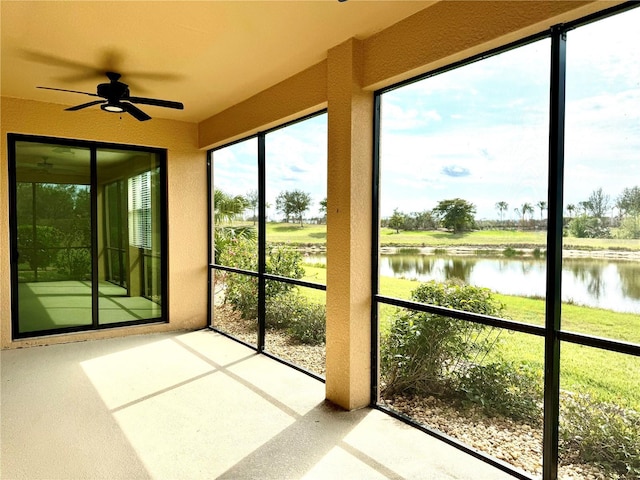 unfurnished sunroom with a water view and a healthy amount of sunlight