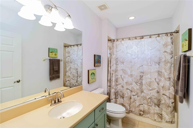 bathroom featuring visible vents, a shower with shower curtain, toilet, vanity, and tile patterned flooring