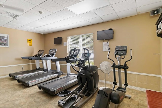 workout area featuring a paneled ceiling and visible vents