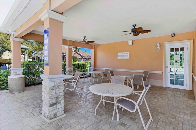 view of patio featuring a ceiling fan and outdoor dining area