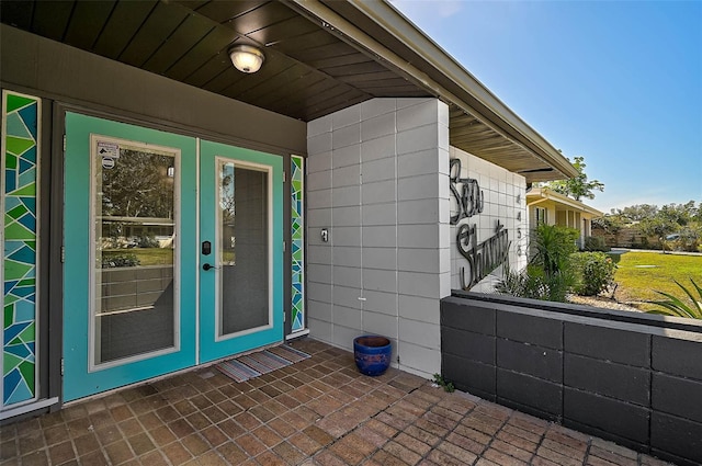 entrance to property with french doors and a patio