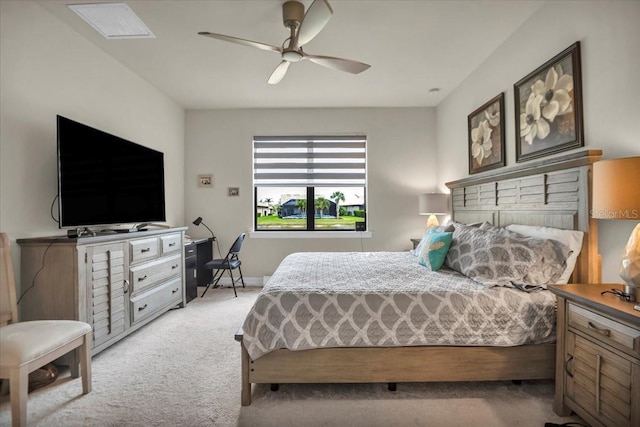 bedroom with light colored carpet and ceiling fan