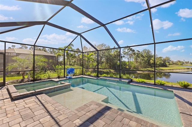 view of swimming pool featuring a patio area, glass enclosure, a water view, and a pool with connected hot tub