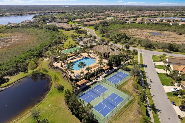 birds eye view of property with a water view and a residential view