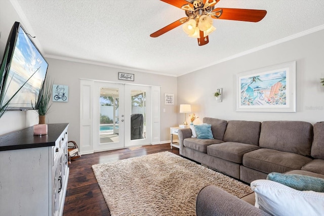 living room with crown molding, a textured ceiling, dark wood-style flooring, and french doors