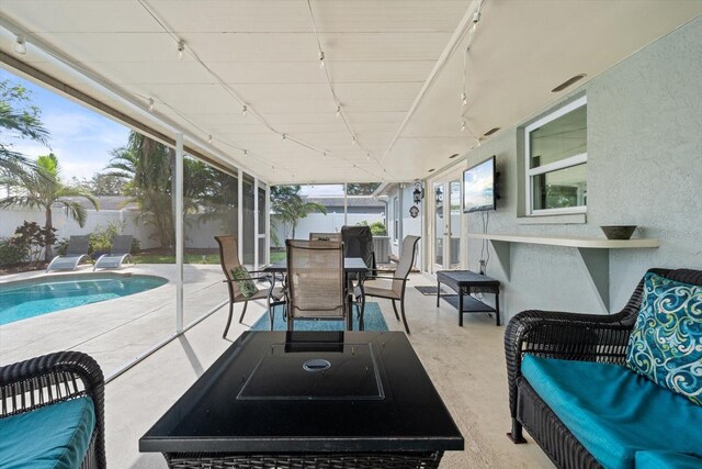 view of patio / terrace with a fenced in pool, outdoor dining space, a fenced backyard, and an outdoor living space