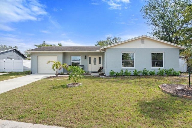 single story home with driveway, a front lawn, an attached garage, and fence