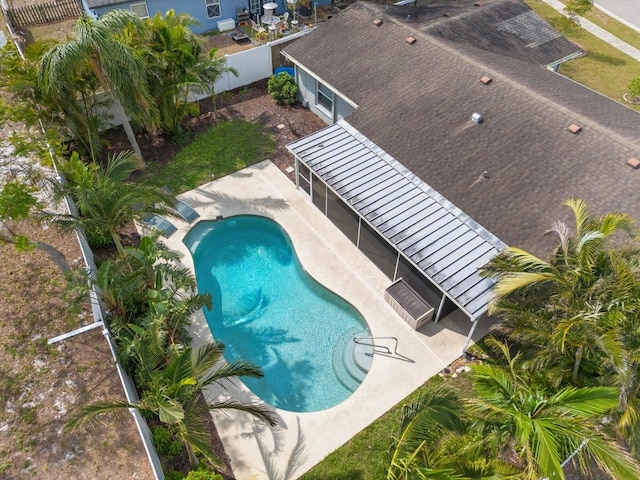 pool featuring fence and a patio