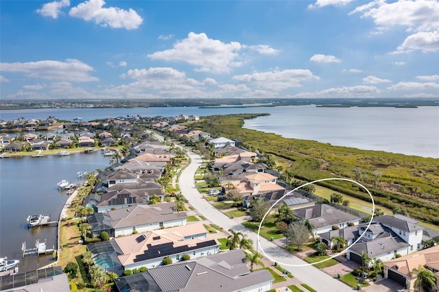 aerial view featuring a water view and a residential view