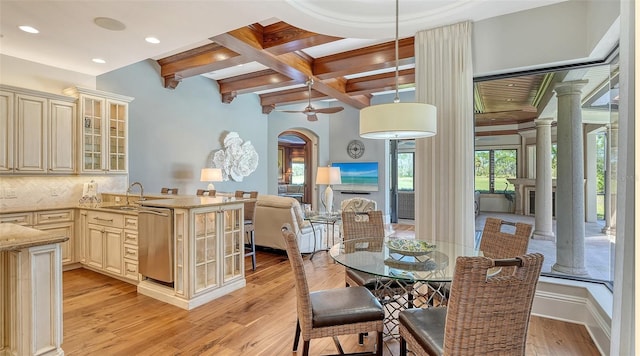 dining space featuring light wood-style flooring, recessed lighting, coffered ceiling, beamed ceiling, and decorative columns