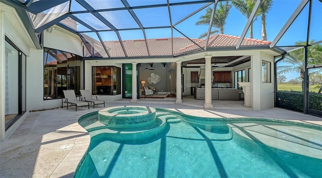 view of pool with a ceiling fan, glass enclosure, a patio area, a pool with connected hot tub, and an outdoor living space