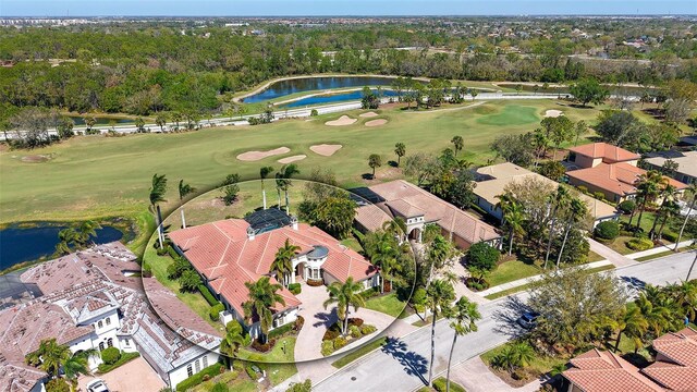 bird's eye view with a residential view, a water view, and golf course view