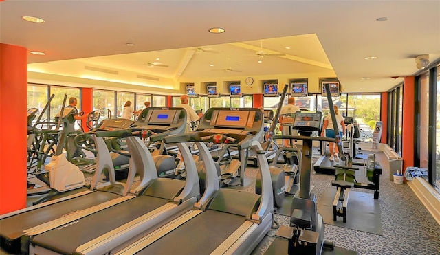 exercise room with a ceiling fan, recessed lighting, and vaulted ceiling