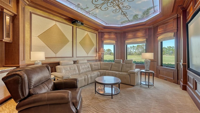 living area with carpet, a decorative wall, and crown molding