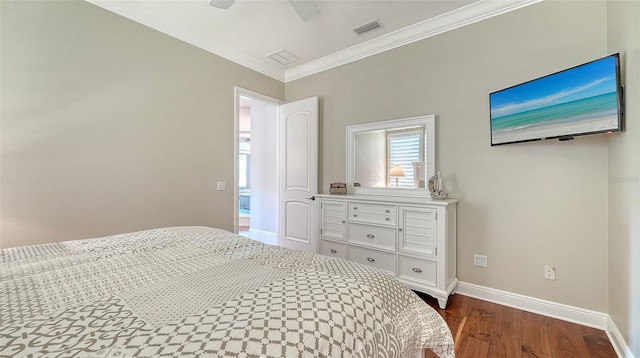 bedroom featuring crown molding, visible vents, dark wood-type flooring, ceiling fan, and baseboards