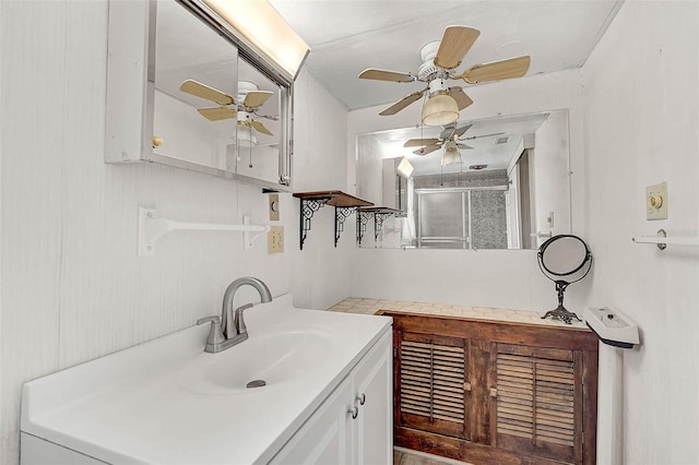 bathroom featuring a shower stall and vanity