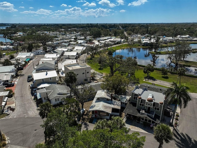 birds eye view of property featuring a water view and a residential view