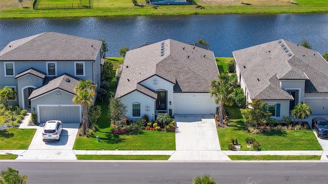 bird's eye view with a water view and a residential view