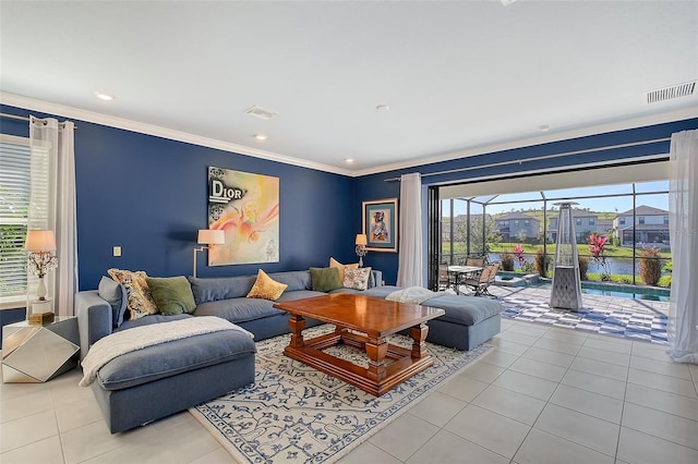 living area with visible vents, crown molding, and light tile patterned floors