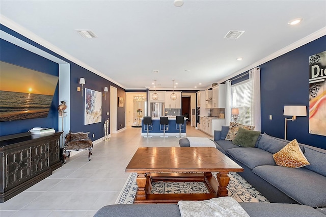 living area with baseboards, visible vents, light tile patterned flooring, crown molding, and recessed lighting