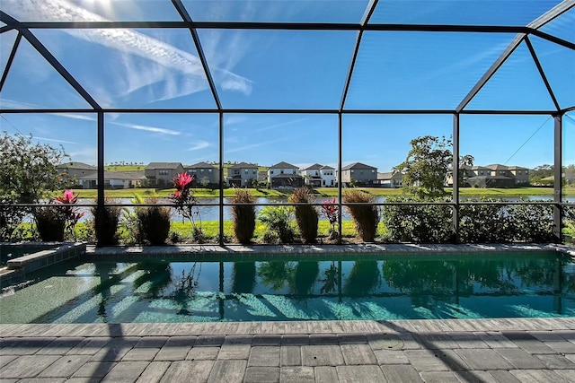 pool featuring a residential view and glass enclosure