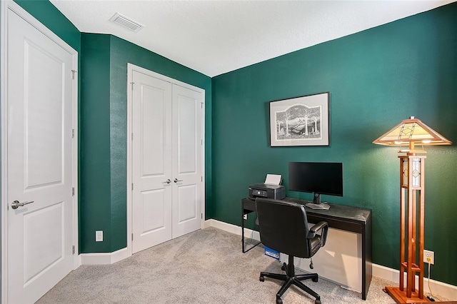 office with light carpet, baseboards, and visible vents