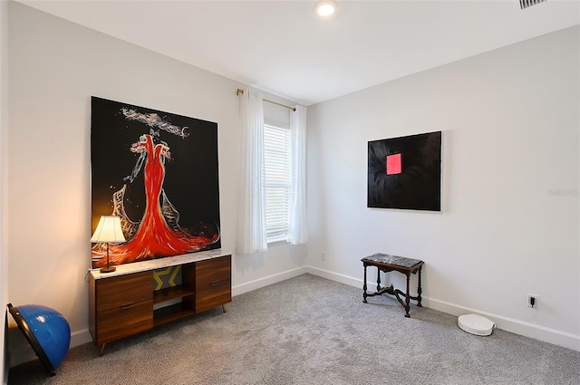 mudroom featuring carpet flooring and baseboards